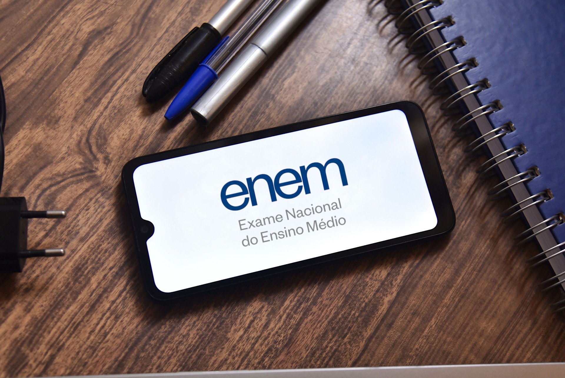 Brazilian National High School Exam (ENEM - Exame Nacional do Ensino Médio), ENEM app on smartphone screen, Brazilian education.